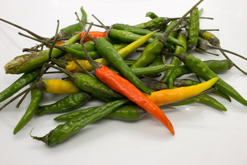 This is a photograph of Thai Chili peppers isolated on a White background