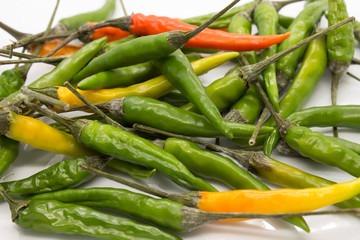This is a photograph of Thai Chili peppers isolated on a White background