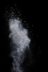 Explosion of colored powder isolated on black background. Abstract colored background. holi festival.