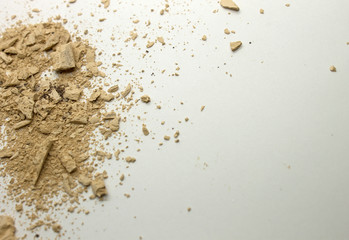 This is a photograph of a Bisque powder eyeshadow isolated on a White background