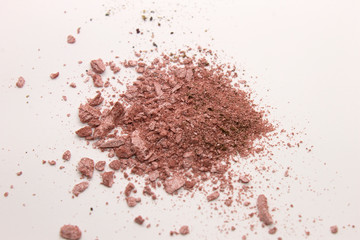 This is a photograph of a Pearly Pink powder eyeshadow isolated on a White background
