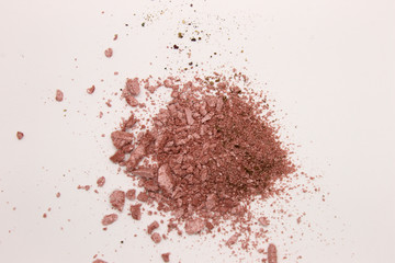 This is a photograph of a Pearly Pink powder eyeshadow isolated on a White background