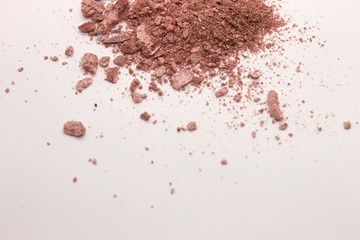 This is a photograph of a Pearly Pink powder eyeshadow isolated on a White background