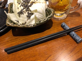 bowl of rice and chopsticks