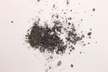 This is a photograph of Gray powder Eyeshadow isolated on a White background