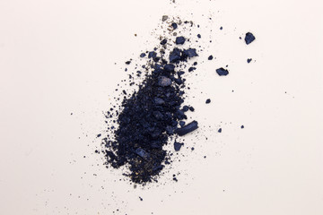 Fototapeta na wymiar This is a photograph of Shimmery Royal Blue powder Eyeshadow isolated on a White background