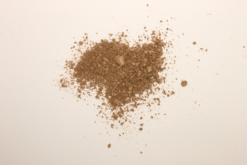 This is a photograph of a Bronzer powder makeup isolated on a White background
