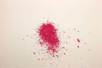 This is a photograph of Fuschia Pink powder Blusher isolated on a White background