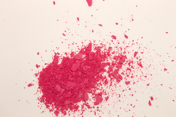 This is a photograph of Fuschia Pink powder Blusher isolated on a White background