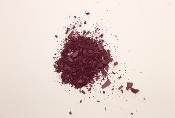 This is a photograph of Plum powder Blusher isolated on a White background