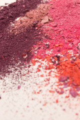 This is a photograph of colorful powder blusher isolated on a White background