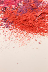 This is a photograph of colorful powder blusher isolated on a White background