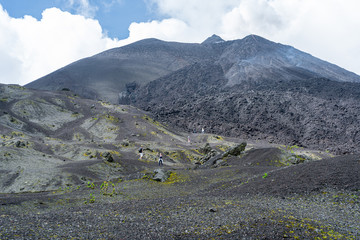People are climbing the Pacaya volcano and some are taking selfies.