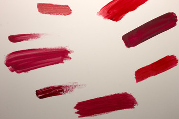 This is a photograph of Red Lipstick swatches isolated on a White background