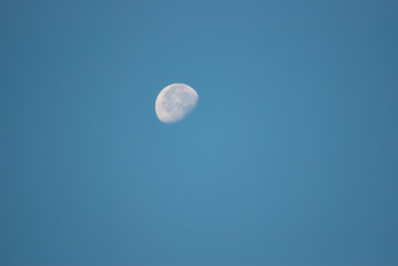Moon Against a Clear Blue Sky