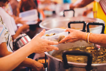 Volunteers give away free food to hungry people : concept of care And feeding