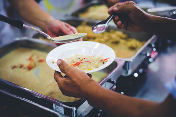 Food donated to hungry people homeless, Free food to beggars : concept of giving