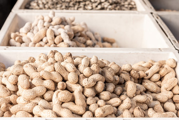 Various types of roasted peanuts, in a street market