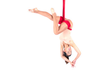 Beautiful woman Asian sport girl fly yoga posing on a red hammock isolated white background ,...