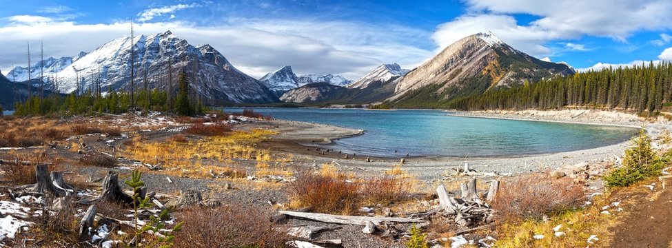 Autumn Colors, Distant Snowcapped Mountain Peaks and Wide Panoramic Landscape of upper Kanananskis Lake in Canadian Rockies, Alberta Canada