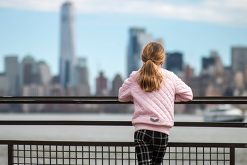 Girl looking out on NYC