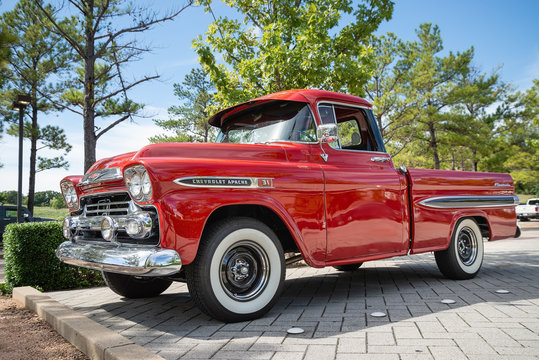 Front view of a red vintage Chevrolet Apache 31 Fleetside pickup truck classic car on October 20, 2018 in Westlake, Texas.