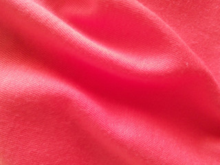 Blurred soft background from close-up red cloth