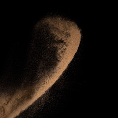 Sand, isolated on black background.