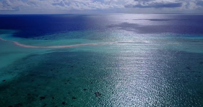 long sand bar in maldives, parallax high angle drone shot