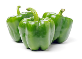 fresh green bell pepper (capsicum) on a white background
