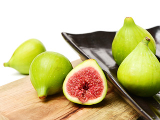 Ripe figs on a white background