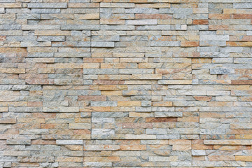 Natural facade stone decoration quartzite background texture. modern granite stone wall