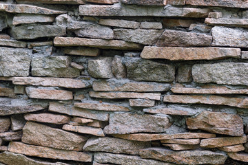 Natural facade stone decoration quartzite background texture. modern granite stone wall