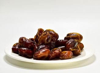 Date palm in the white plate on a white background.In palm.