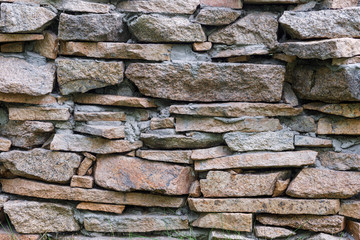 Natural facade stone decoration quartzite background texture. modern granite stone wall