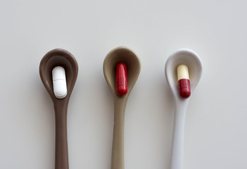 pills inside spoons