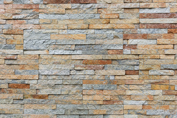 Natural facade stone decoration quartzite background texture. modern granite stone wall