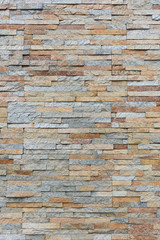Natural facade stone decoration quartzite background texture. modern granite stone wall