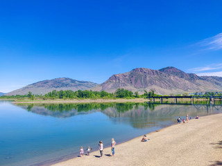 2019-08-20 Kamloops, British Columbia, Canada. Riverside Park. People relaxing on the beach on the...