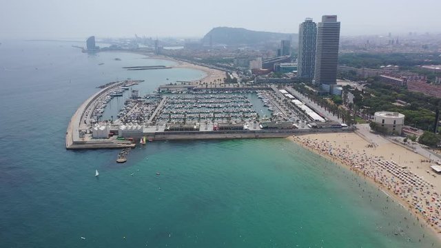 BARCELONA, SPAIN - JULY 07, 2019: Aerial panoramic view of modern Barcelona cityscape on Mediterranean coast 