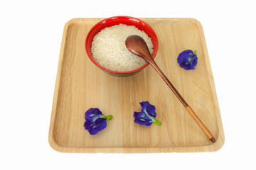 thai jasmine rice with flower on wooden tray