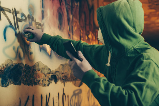 Graffiti Artist Painting With Aerosol Spray.