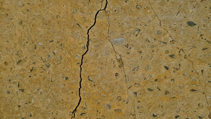  A crack on the concrete wall surface of a house in Los Angeles. Background image for your design