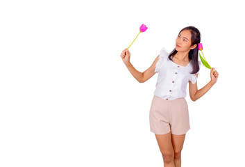 An Asian girl in white tank top and baige trunk holds pink plastic flower in her hands.