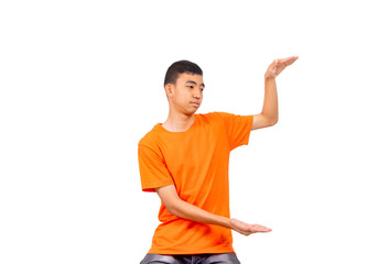 An asian man in orange shirt is estimating size with his hands white background