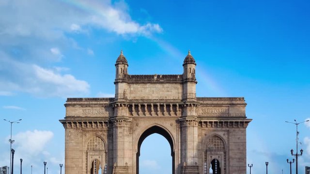 Zooming In Footage of a Rainbow over Mumbai's Iconic Gateway of India, a famous arch monument built during the 20th century.