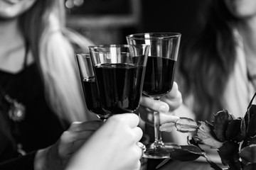 Red Wine Toasting. Female Friends Toasting With Red Wine, Having Fun.