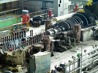 Power generator steam turbine in repair process, machinery, pipes, tubes at power plant