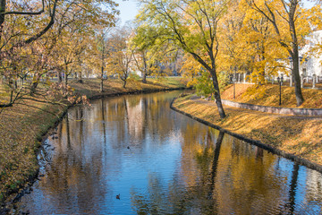 Fototapeta na wymiar River Running through the Center of a City in Northern Europe in Autumn