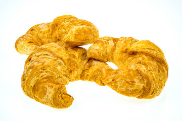 big fresh croissants on white background